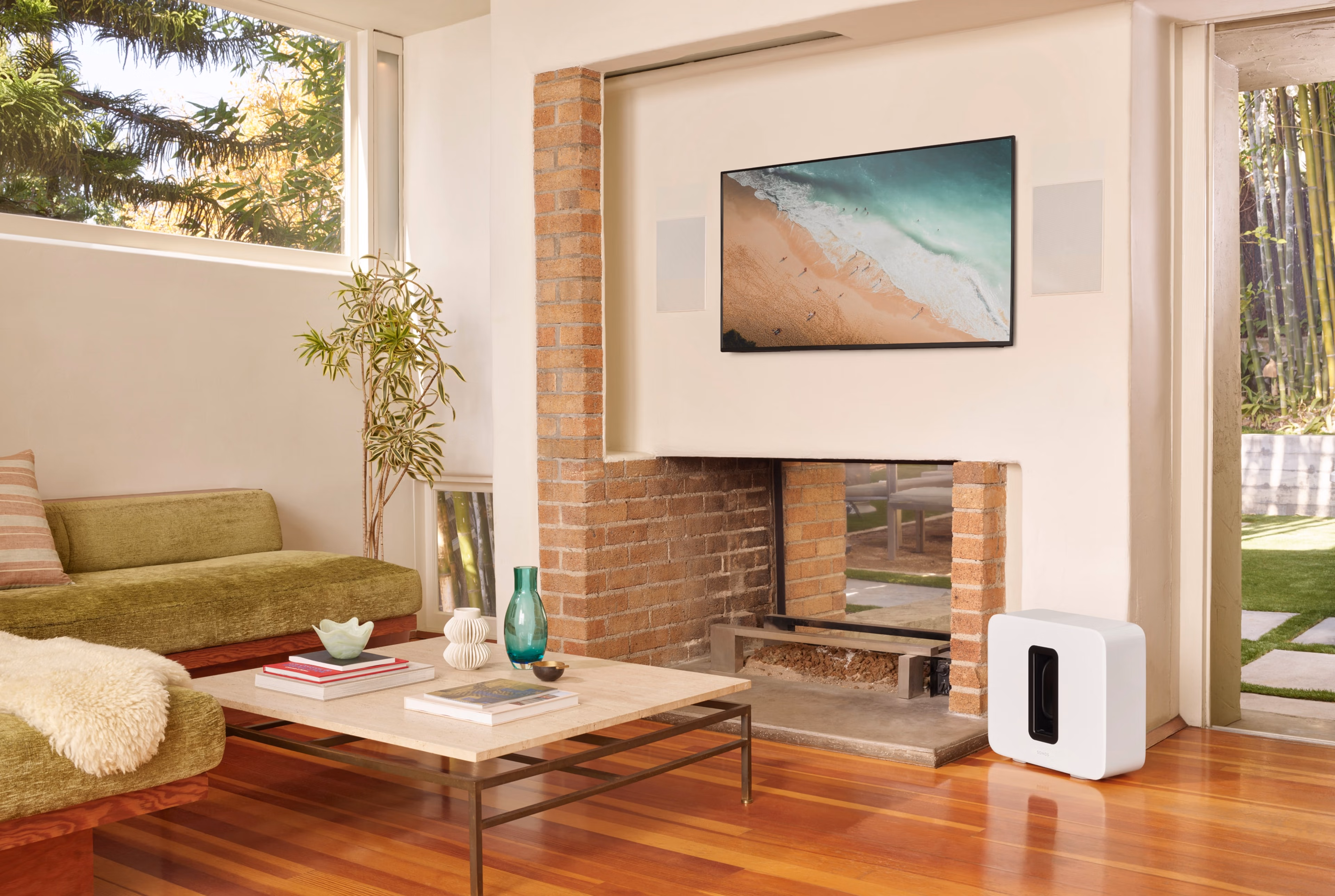 Home theater system with Sonance In-Wall speakers and white Sonos Sub