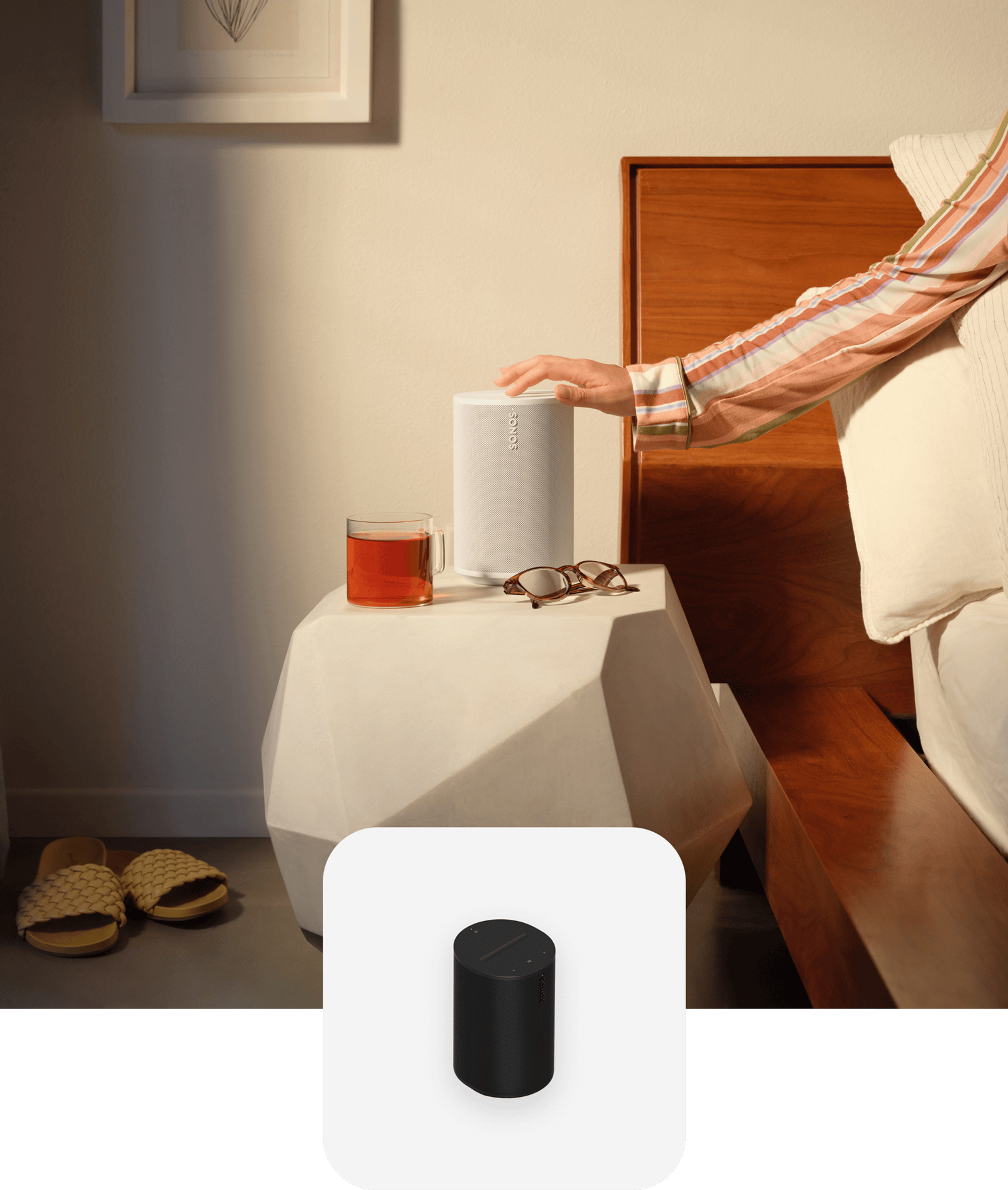 Hand touching a white Era 100 on a nightstand with black Era 100 product tile overlay