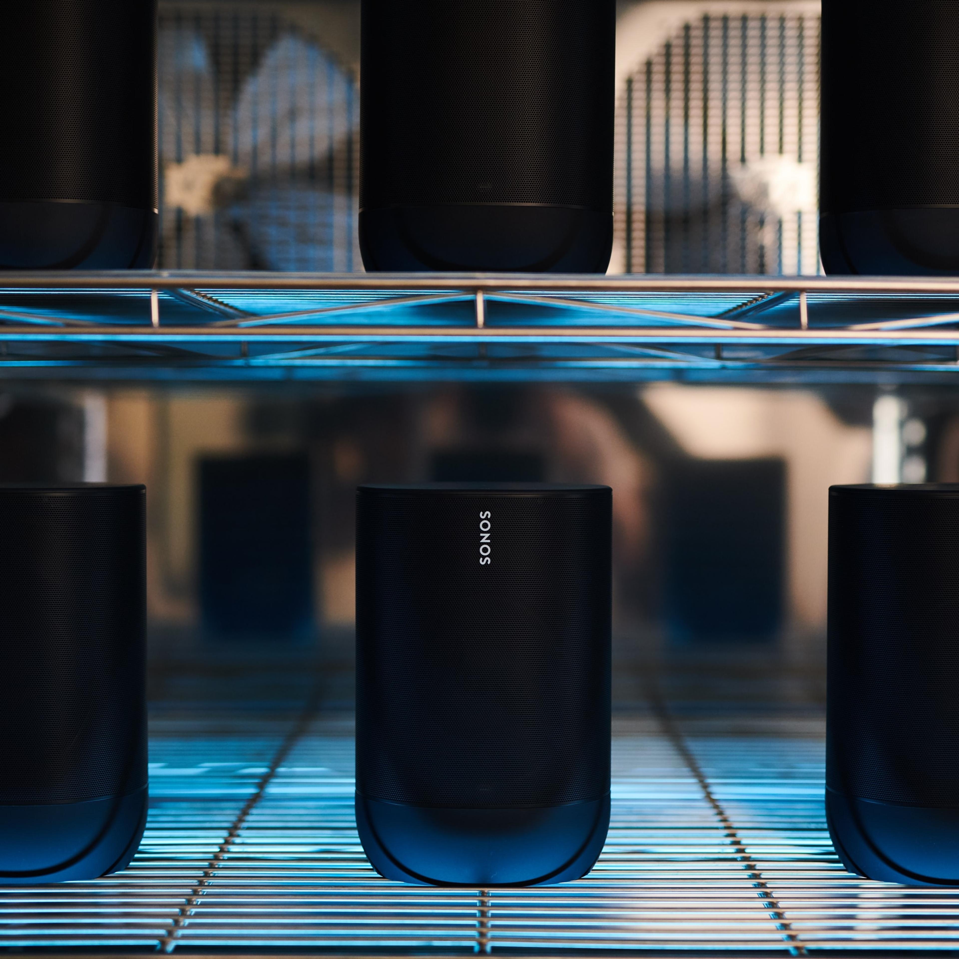 Six Sonos Move speakers on shelves in the hardware lab being temperature tested