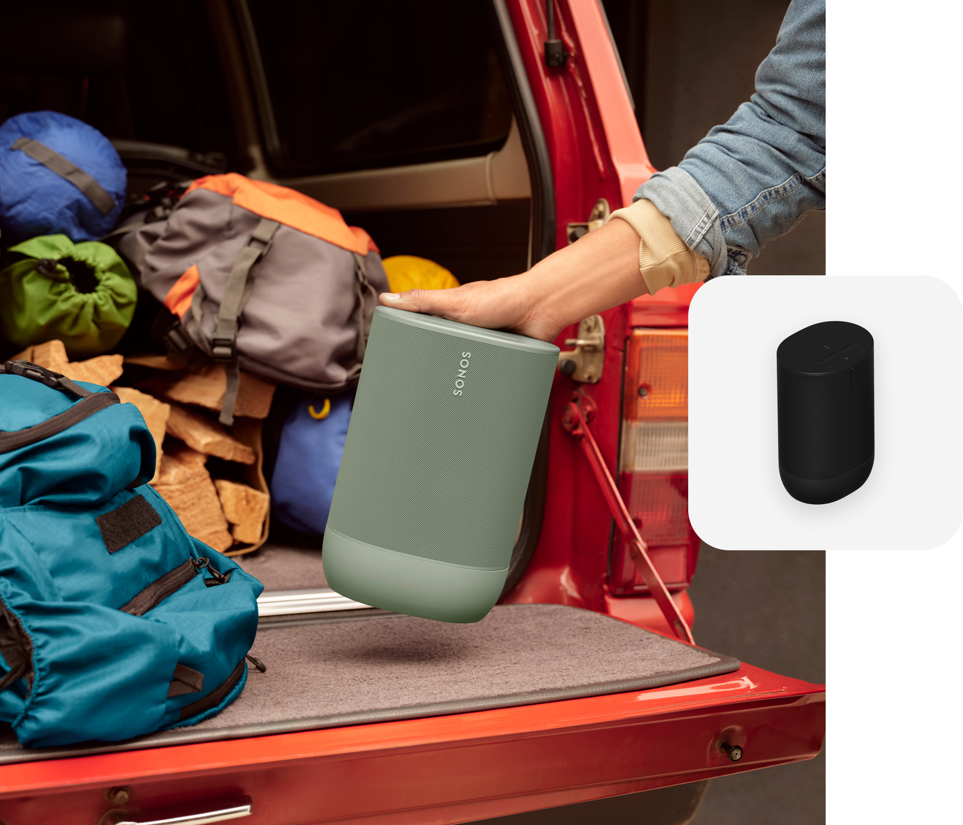 User loading up an olive colored Move 2 in the back of a truck for a camping trip