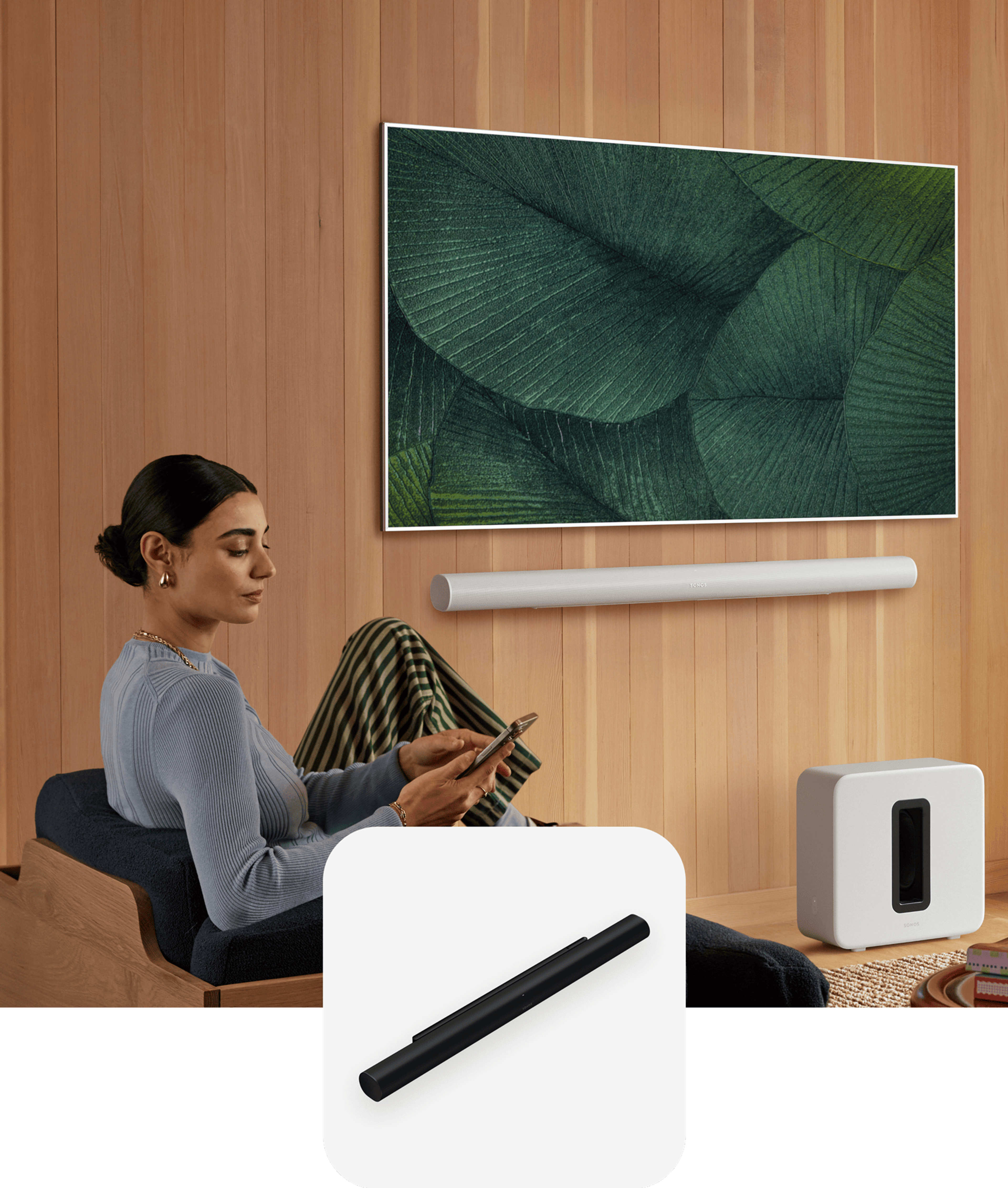 Person sitting and using a phone with Sonos Arc Ultra and TV in the background and a Arc Ultra product tile overlay