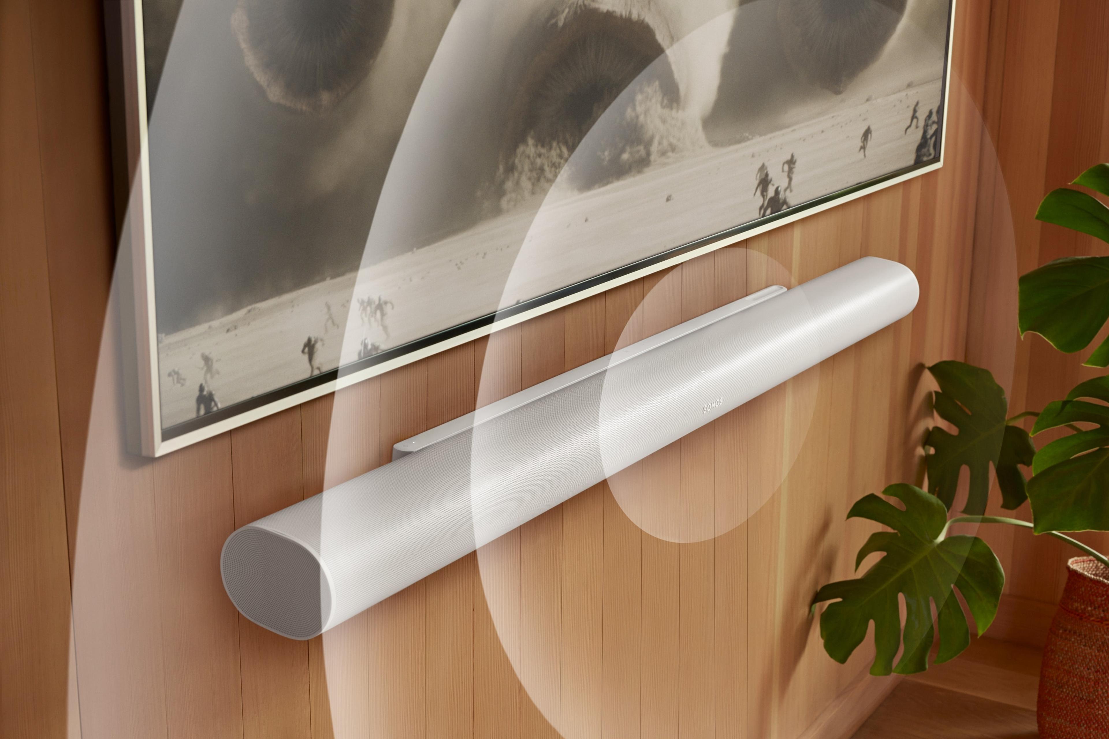 A white Arc Ultra mounted below a TV with animated sound waves and screen content from Dune 2